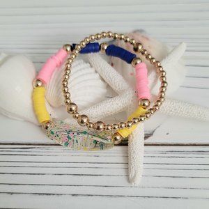 Multi colored- acrylic tube bead heishi bracelet with gold bead accent bracelet.